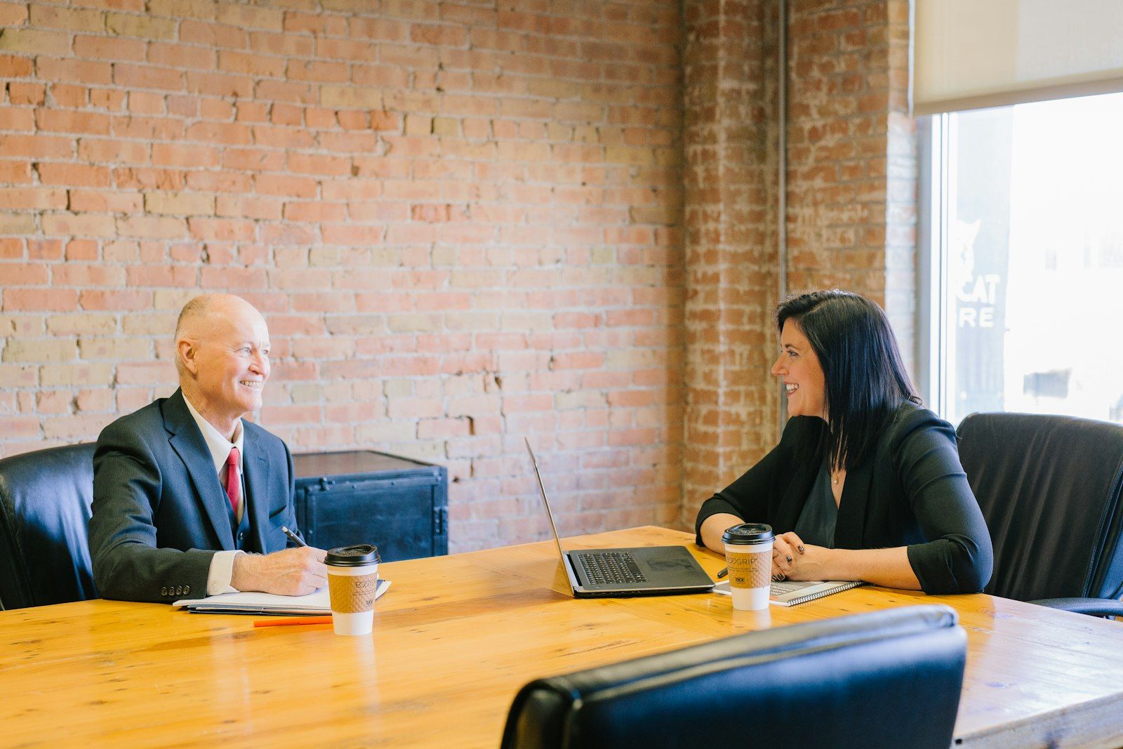 An adviser meeting with a client in a bright office